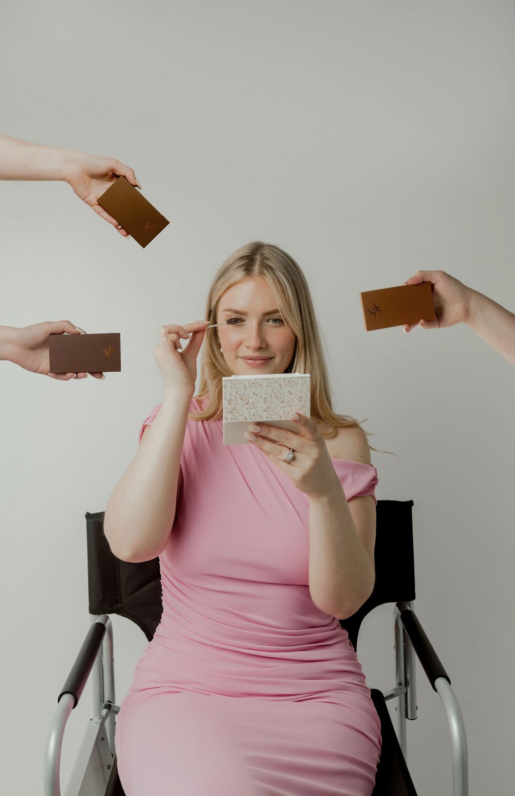Lindsey Heilman in her studio surrounded by Light Heart lash palettes